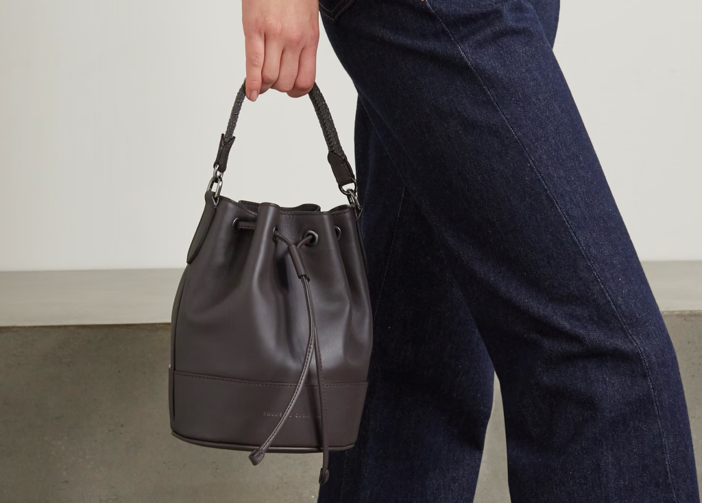  An elegant leather bucket bag with a chain strap, available in various colors, offering a sophisticated and versatile accessory for both casual and formal occasions in 2024.